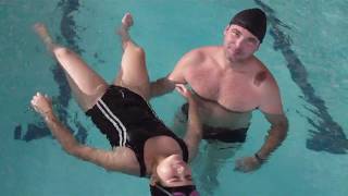 father and daughter relaxing in the pool