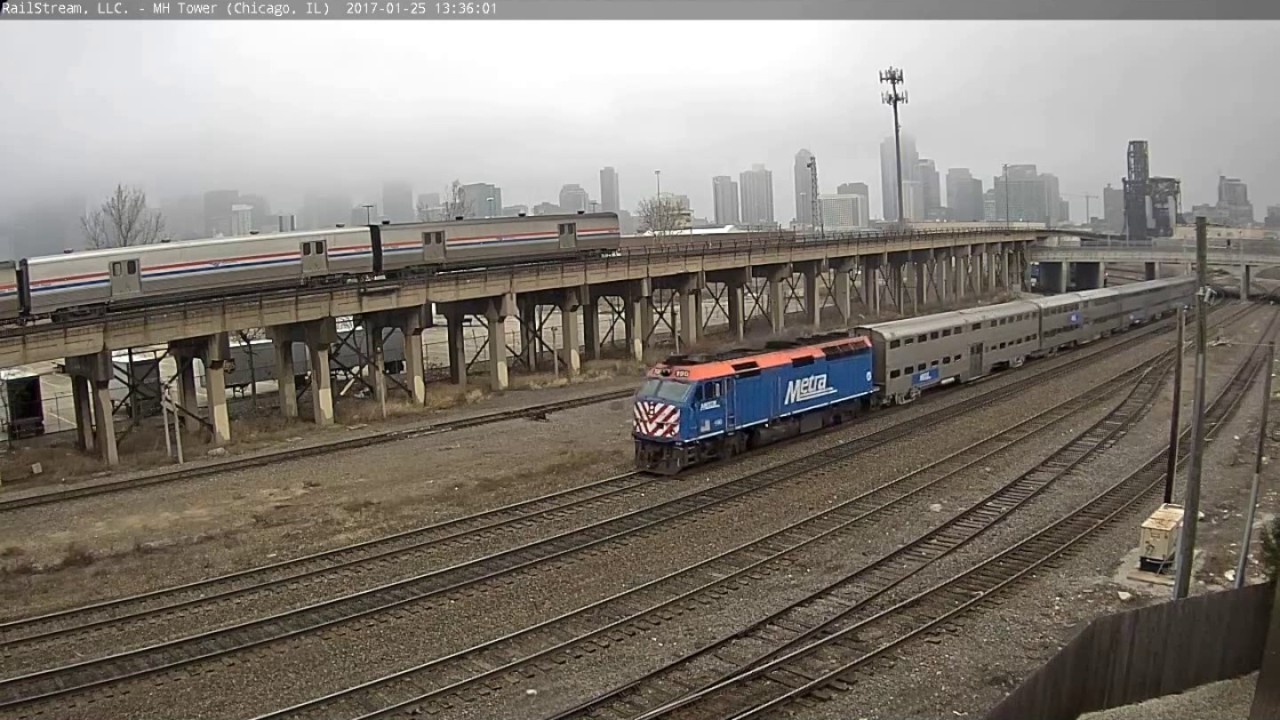 Amtrak With Three Baggage Cars, Metra, and BNSF High Rail Truck In