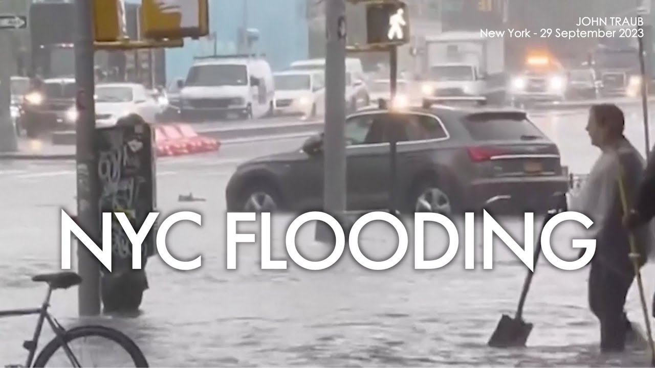 SCENE: Storm floods streets and subway in New York, stranding people in ...