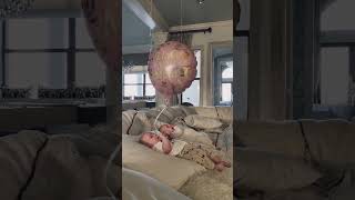 Amanda Cerny's baby under pink balloons