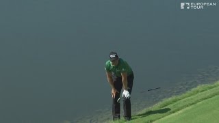Henrik Stenson holes out from the water