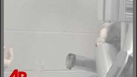 Raw Video: Monkey Eats With Robotic Arm