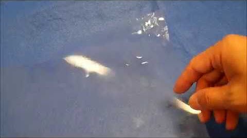 Removal of crease and stress whitening atop plastic membrane