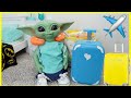 Baby yoda packing suitcase for vacation 