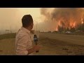 Caught on camera: Fort McMurray fire erupts behind Global News reporter