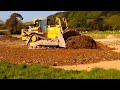 CAT D8 dozer at work pushing gravel for road construction