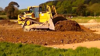 CAT D8 dozer at work pushing gravel for road construction
