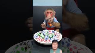 Baby Monkey Holds So Many Tiny Balls in Its Mouth! 🐒😲 #BabyMonkey #CuteAnimals #shortsfeed