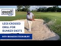 Get out of the sand trap every time learn the legs crossed bunker shot drill