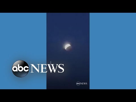 Skywatchers glimpse total lunar eclipse