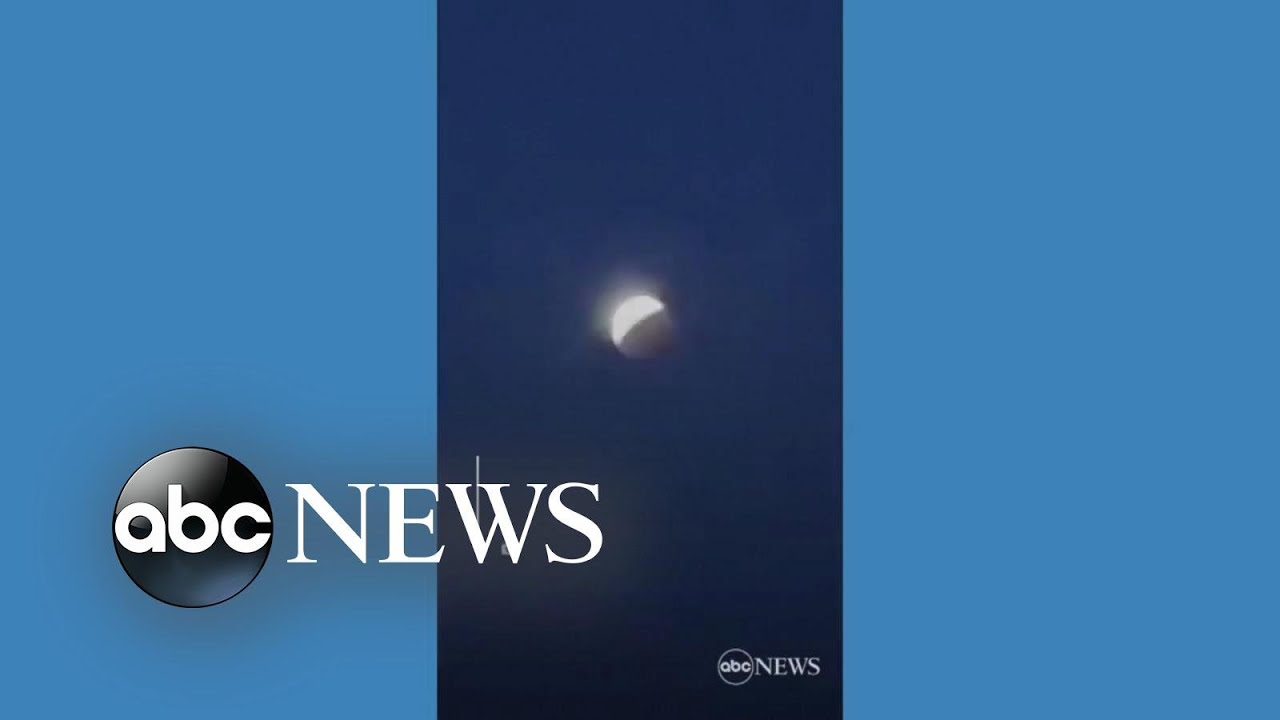 Skywatchers glimpse total lunar eclipse