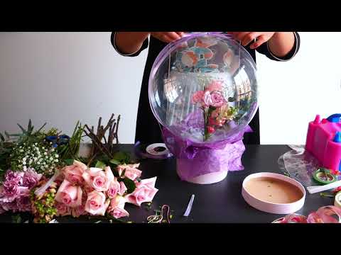 Easy DIY Bobo Balloon Fresh Flowers Centerpiece. Learn how to put flowers inside a balloon!