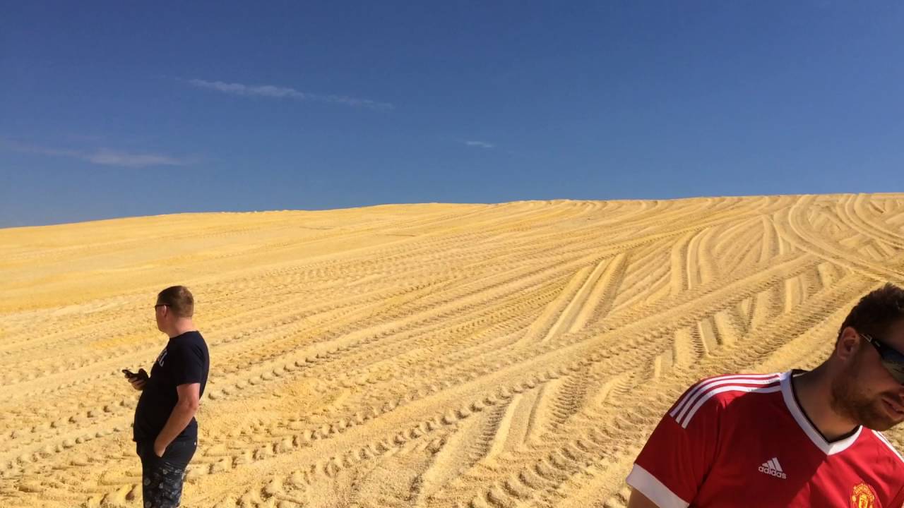 John Deere pushing up maize in hoxie