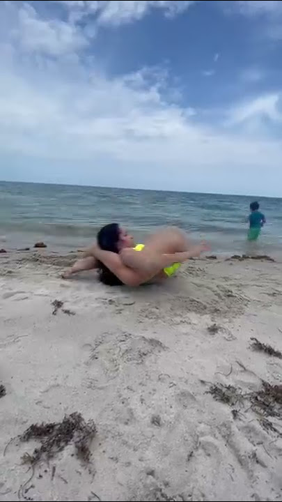 Sleeping yoga pose at the beach! #shorts #short #yoga #beach #sleep #flexibility #yogapose