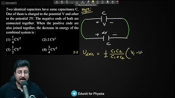 Two identical capacitors have same capacitance C. One of them is charged to the potential V and