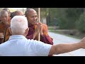 Walk for Peace: Buddhist monks and their dog Aloka stop at Wat Phouthasamakhy Lao in Houston