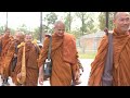 Walk for Peace: Buddhist monks and their dog Aloka stop at Wat Phouthasamakhy Lao in Houston