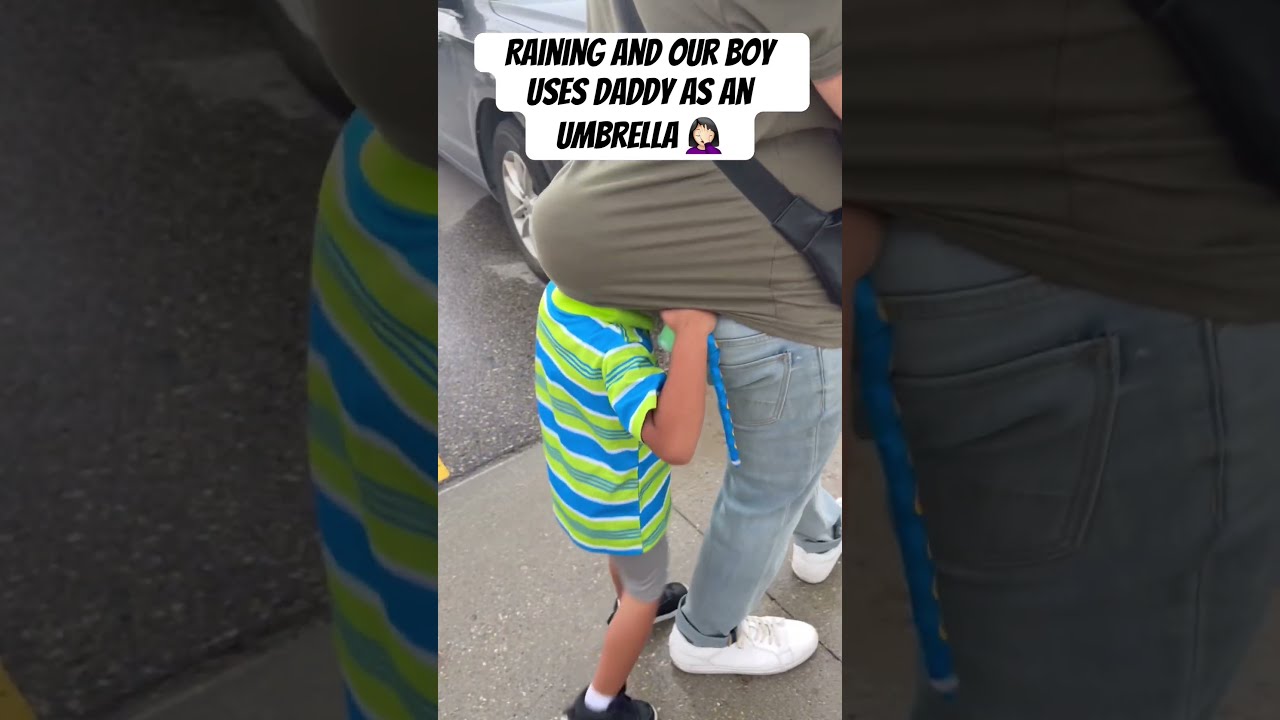Silly Boy Uses Daddy As An Umbrella