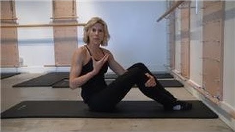 Pilates Exercises : Lying Knee Roll-Over Stretch