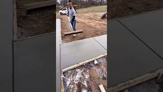 Download Lagu Worker applying a broom finish texture to a newly poured concrete sidewalk MP3