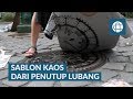 SABLON KAOS DENGAN PENUTUP LUBANG JALAN