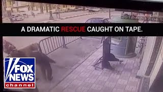 Dramatic rescue: Police catch falling child from third floor