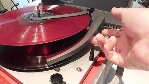 Columbia 4 speed automatic record player playing a couple 33.3 RPM LP records.