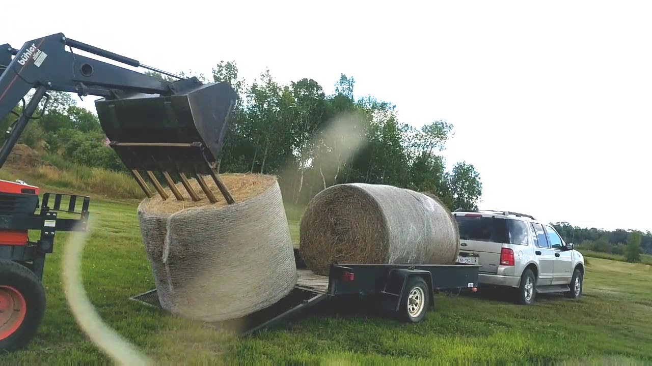 How to unload 3 bales of hay in 1 minute ;) - YouTube