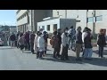 Japan: People line up for supplies at quake relief centre | AFP