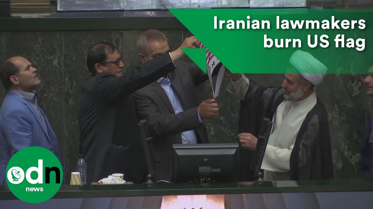 Iranian lawmakers burn US flag