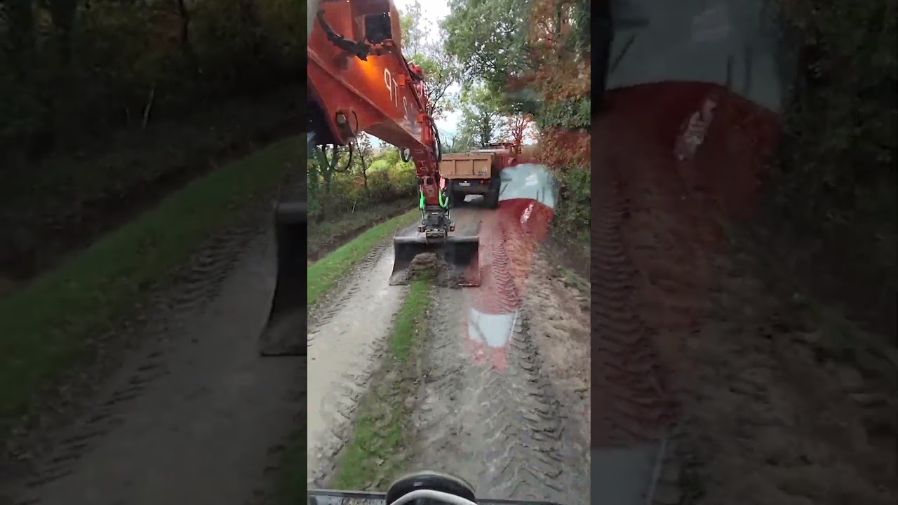 Road Maintenance Works – Removing the Mud Layer With an Excavator