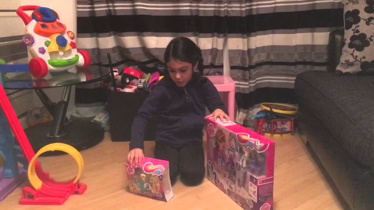 Kid playing with teksta dog and my little pony