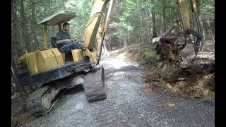 Fixing a driveway and digging behind a building