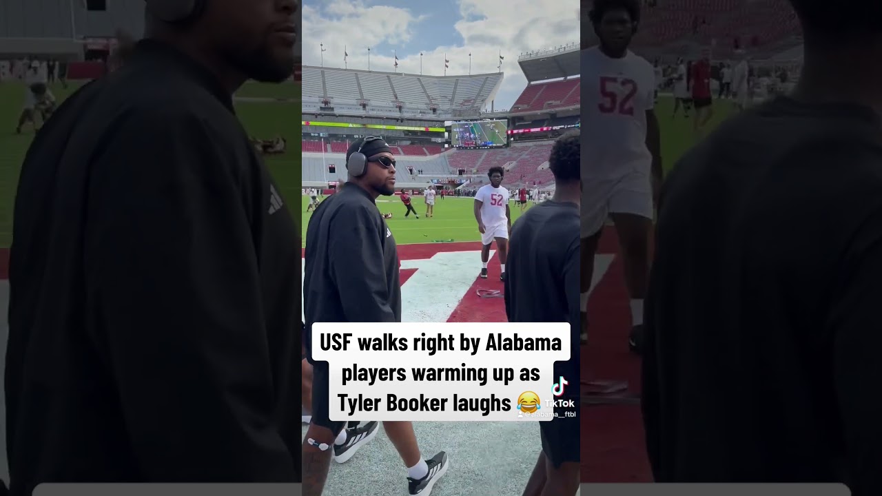 WATCH: USF walks by Alabama players as Tyler Booker laughs 😂 #RollTide