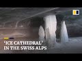 ‘Ice cathedral’ formed by snowmelt awes visitors in Swiss Alps
