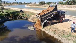 The project looks interesting. With a Komatsu D20-A pushing the soil into the field