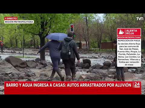 Emergency teams conduct rescues for people trapped by mudslide
