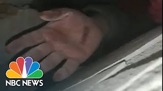 Man waves at rescuers after being trapped under rubble for 208 hours