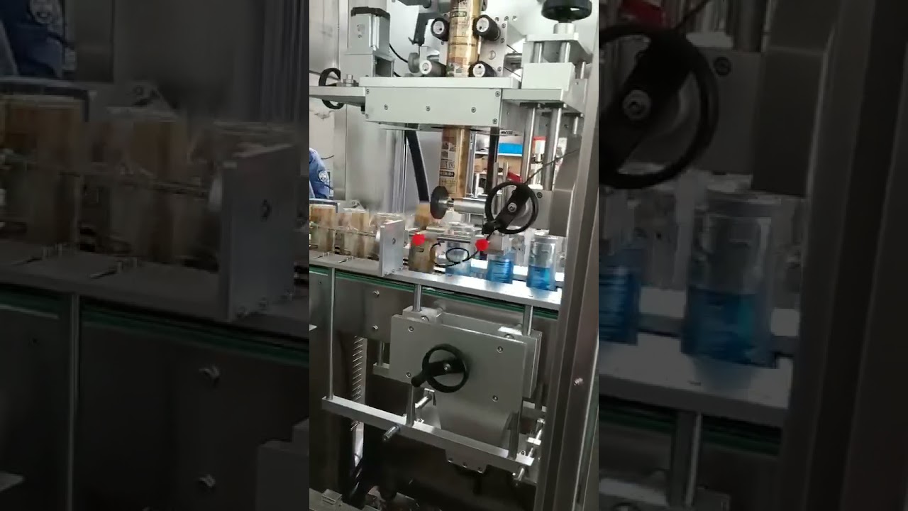 Automatic aluminum can shrink sleeve applicator