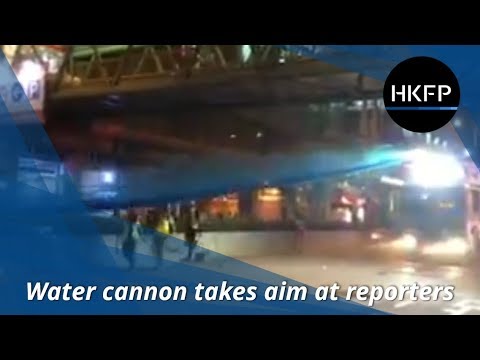 Hong Kong police water cannon takes aim at reporters in Sham Shui Po