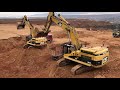 Cat 365C Excavators Loading Trucks