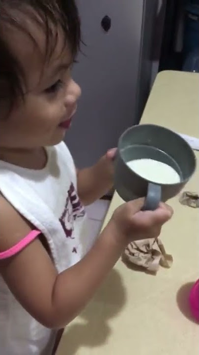 baby x drinking milk from the cup