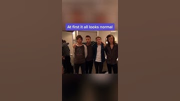 Louis Tomlinson teasing Liam Payne and pulling on his shirt while they read it holds his hand