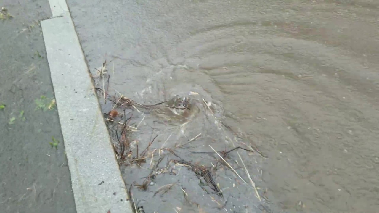 Unclogging Street Drains To Eliminate Flood - YouTube
