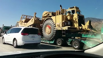 Kenworth T800W Hauling A Caterpillar 657 Scraper Up The Westbound I-10 Grade At Palm Desert, Cali