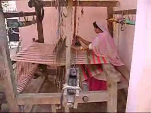 Weaving of Bed Covers and Durries on Hand operated looms by recycling old and torn clothes and woolens. This is practiced in the villages of Yamunanagar district of Haryana state in India. This video has been shot in village Bhagwangarh.