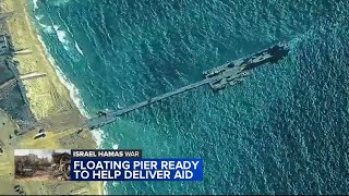US military says first aid shipment has been driven across a newly built US pier into the Gaza Strip