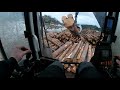 Unloading Timber From A Timber Truck