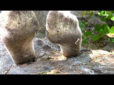 JK girl playfully dirty white socks in the mud