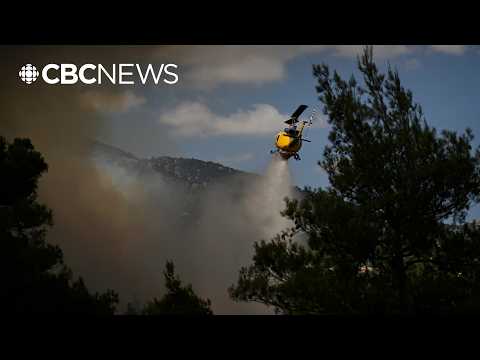 Two helicopters <strong>collide</strong> near Athens as Greece battles wildfires, killing 2 crew members